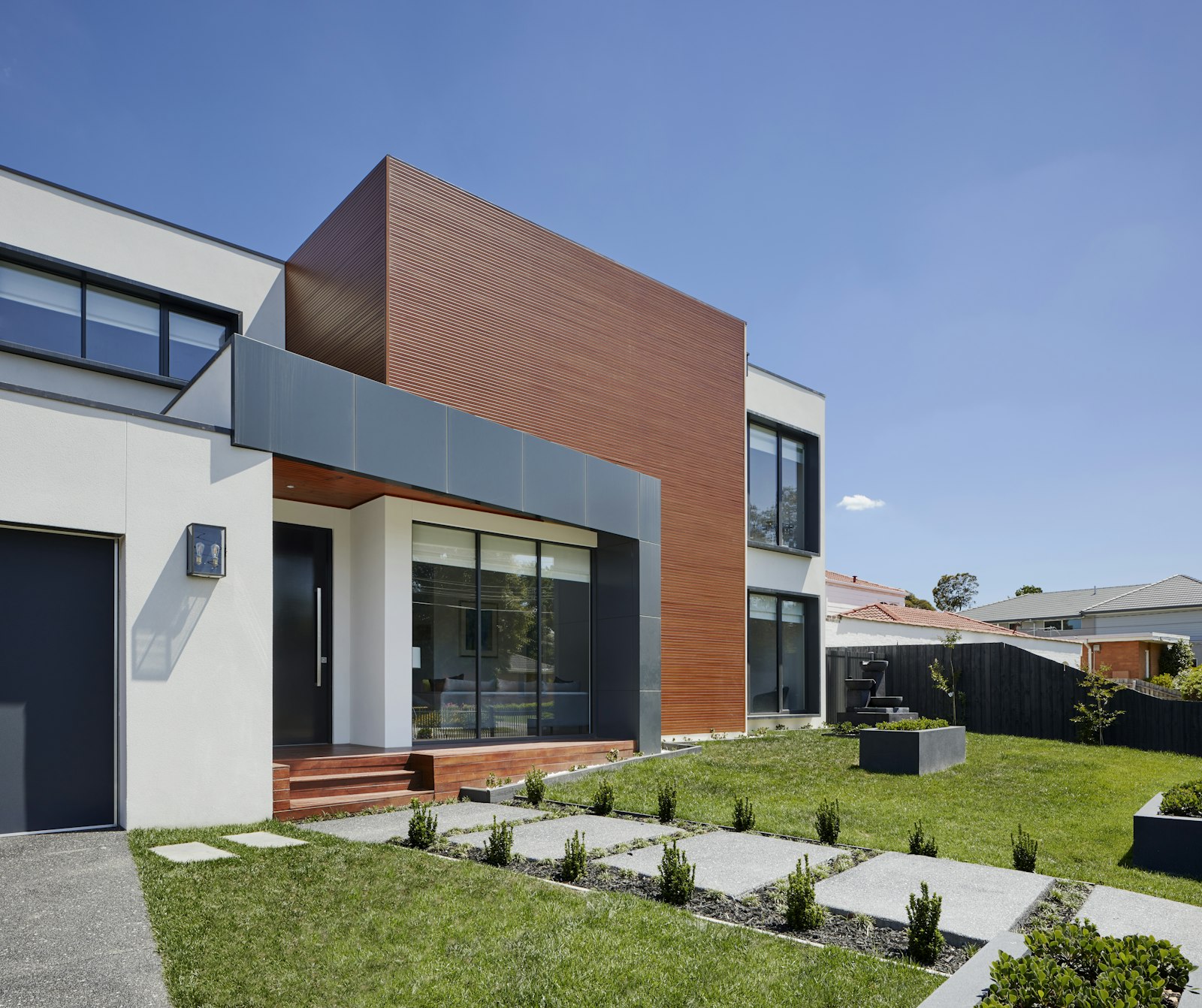New entry door and sliding glass doors on a modern home